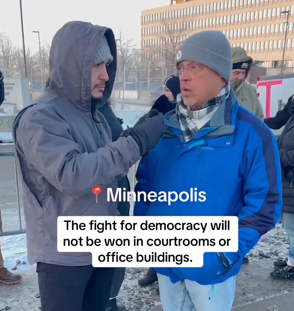A screenshot of a video of Abdul talking with Keith Ellison at the ICE protest in Minnesota