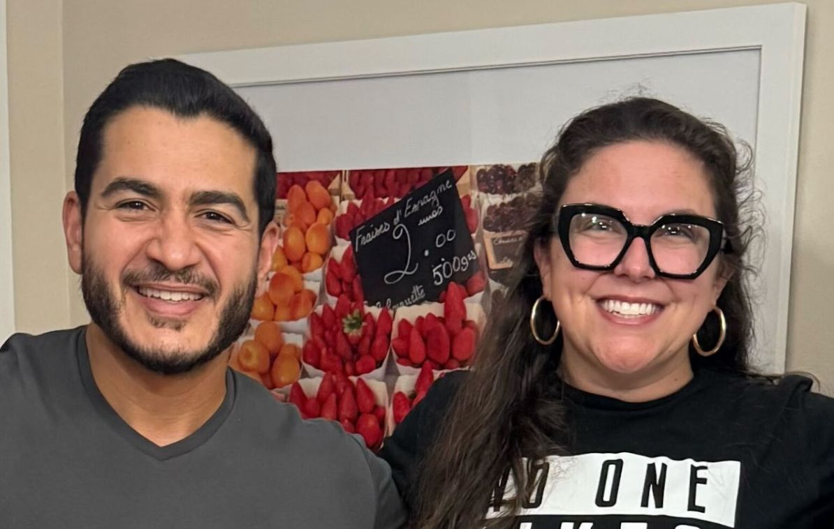 Katie and Abdul smiling for a photo