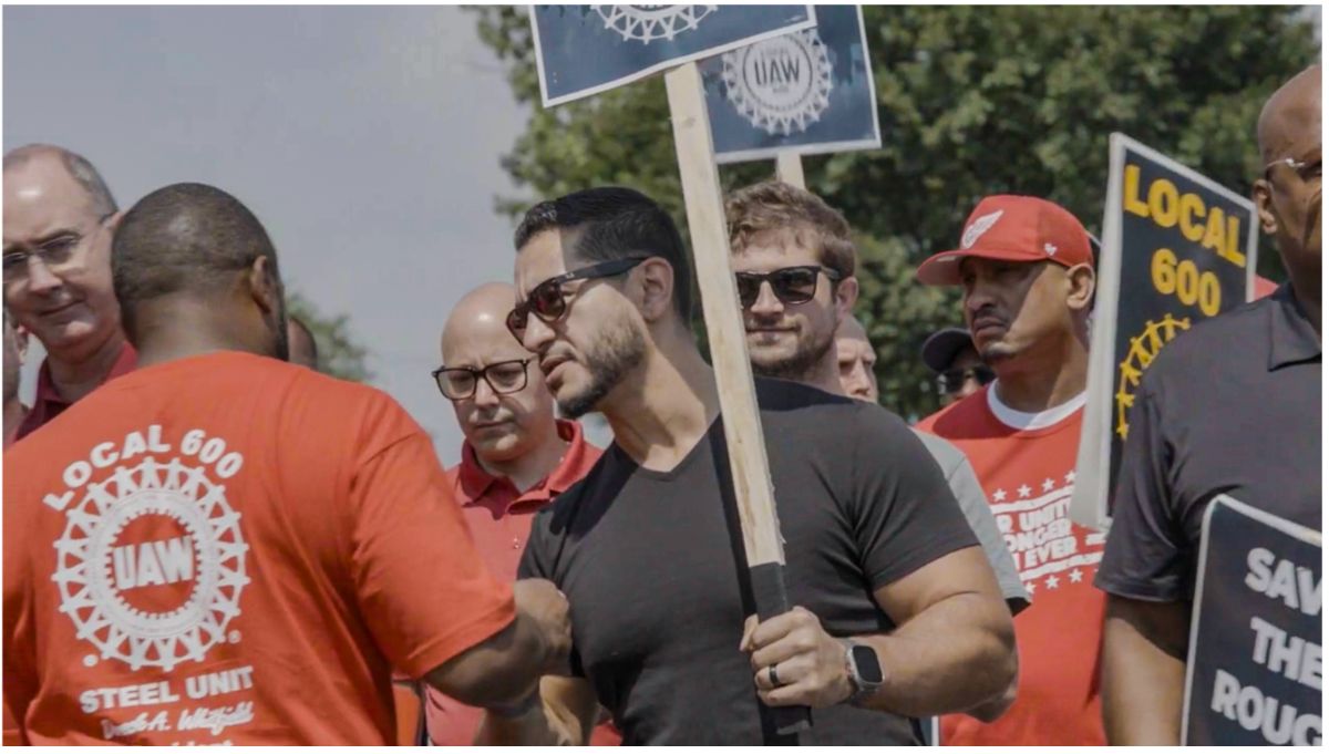 Abdul on the picket line with UAW members