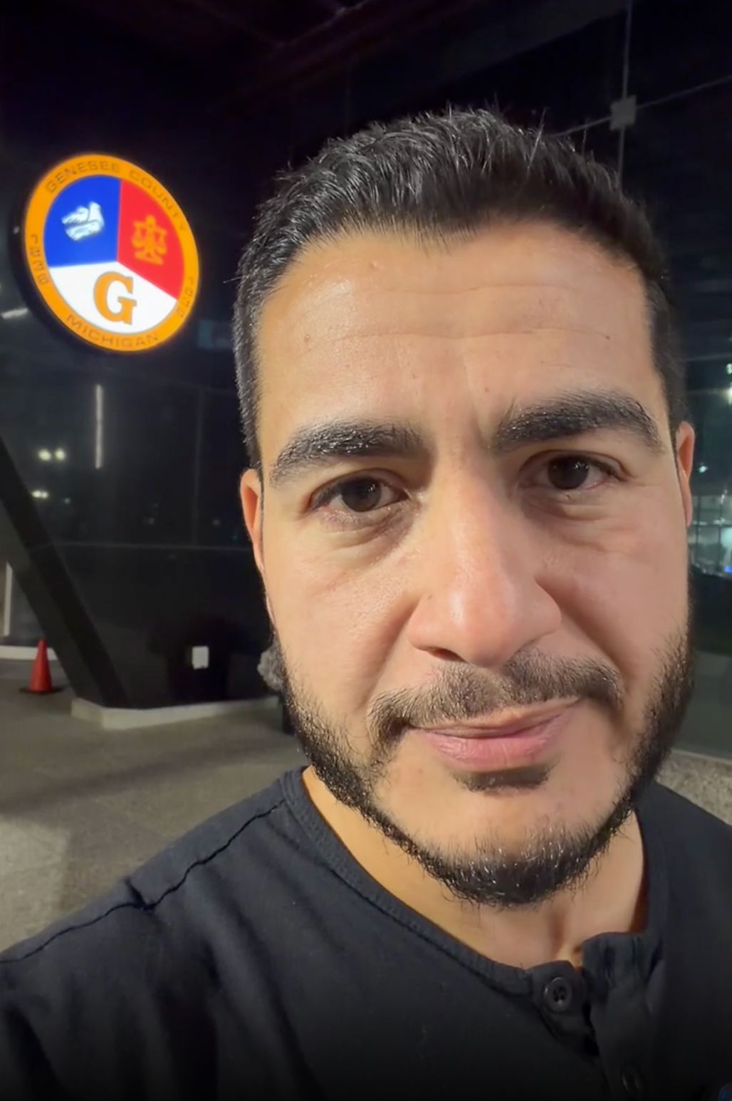 Abdul standing in front of the Genesee County WIC office